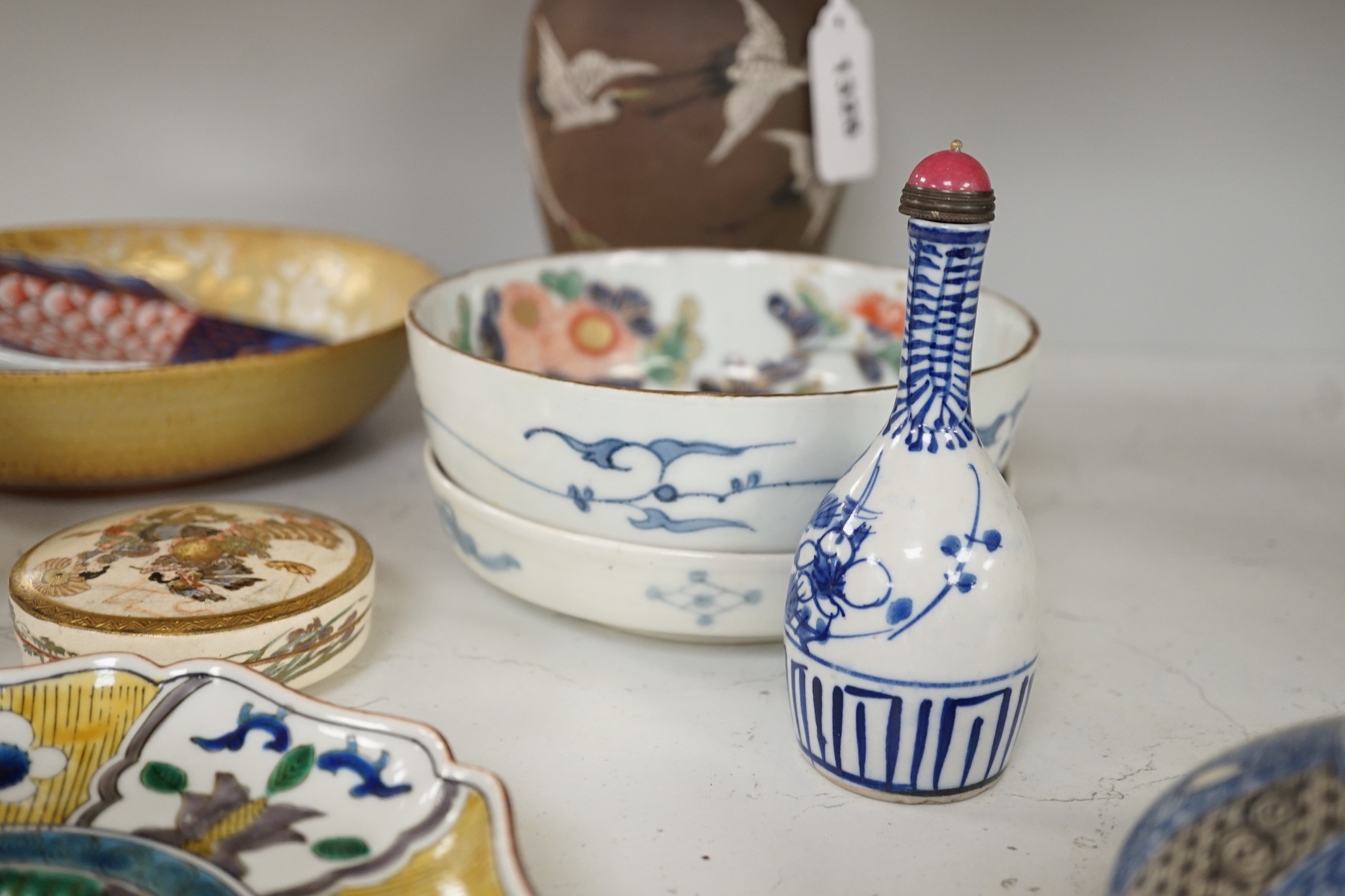 A group of 19th/20th century Japanese ceramics, Including five dishes, three vases, a cup, a Satsuma box and cover and a model of a dog